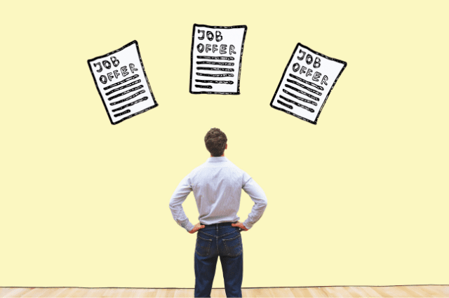 A man standing in front of a yellow wall with illustrations of three job offers